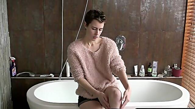 Angora sweater girl strips and hops in the bathtub to finger